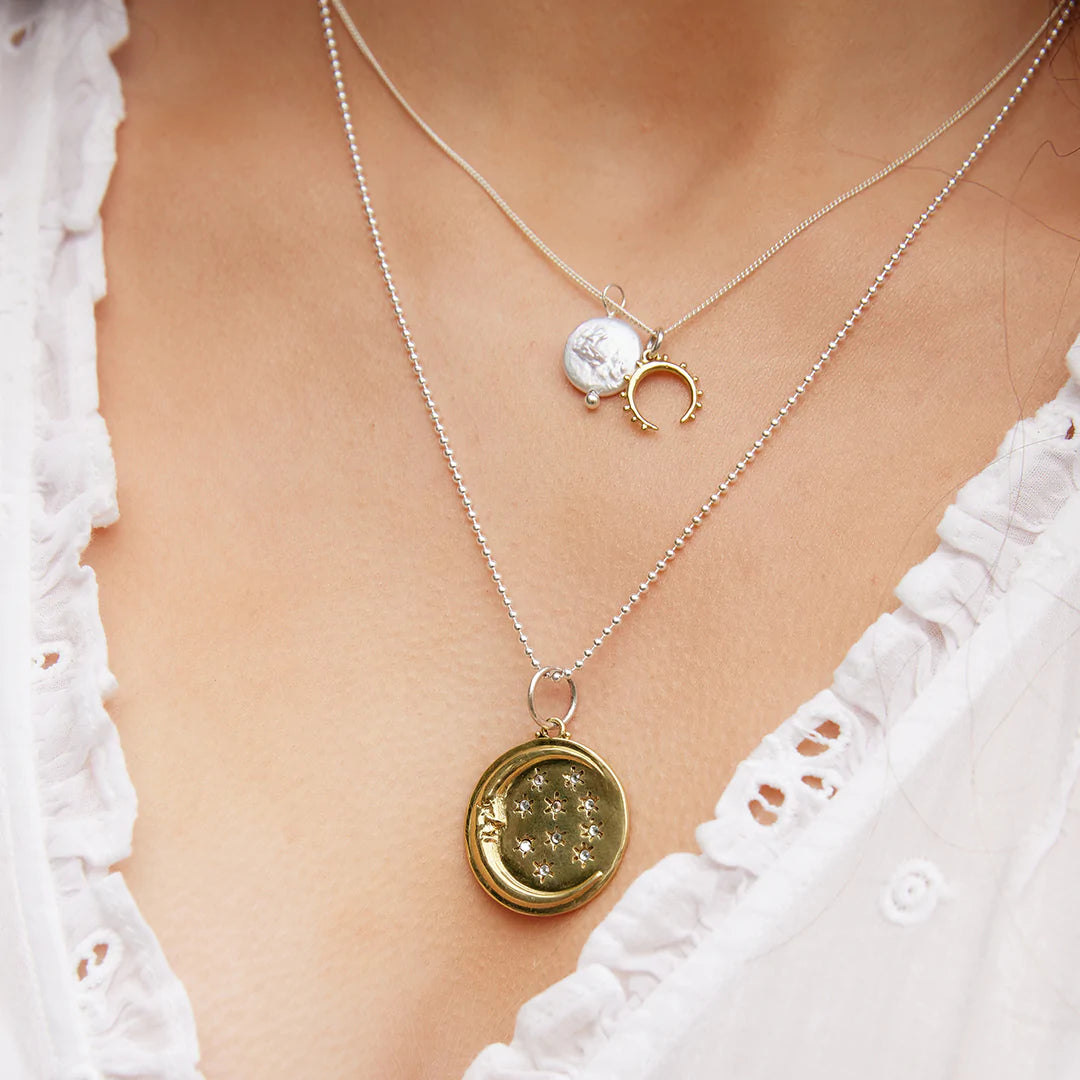 Glistening moon charm