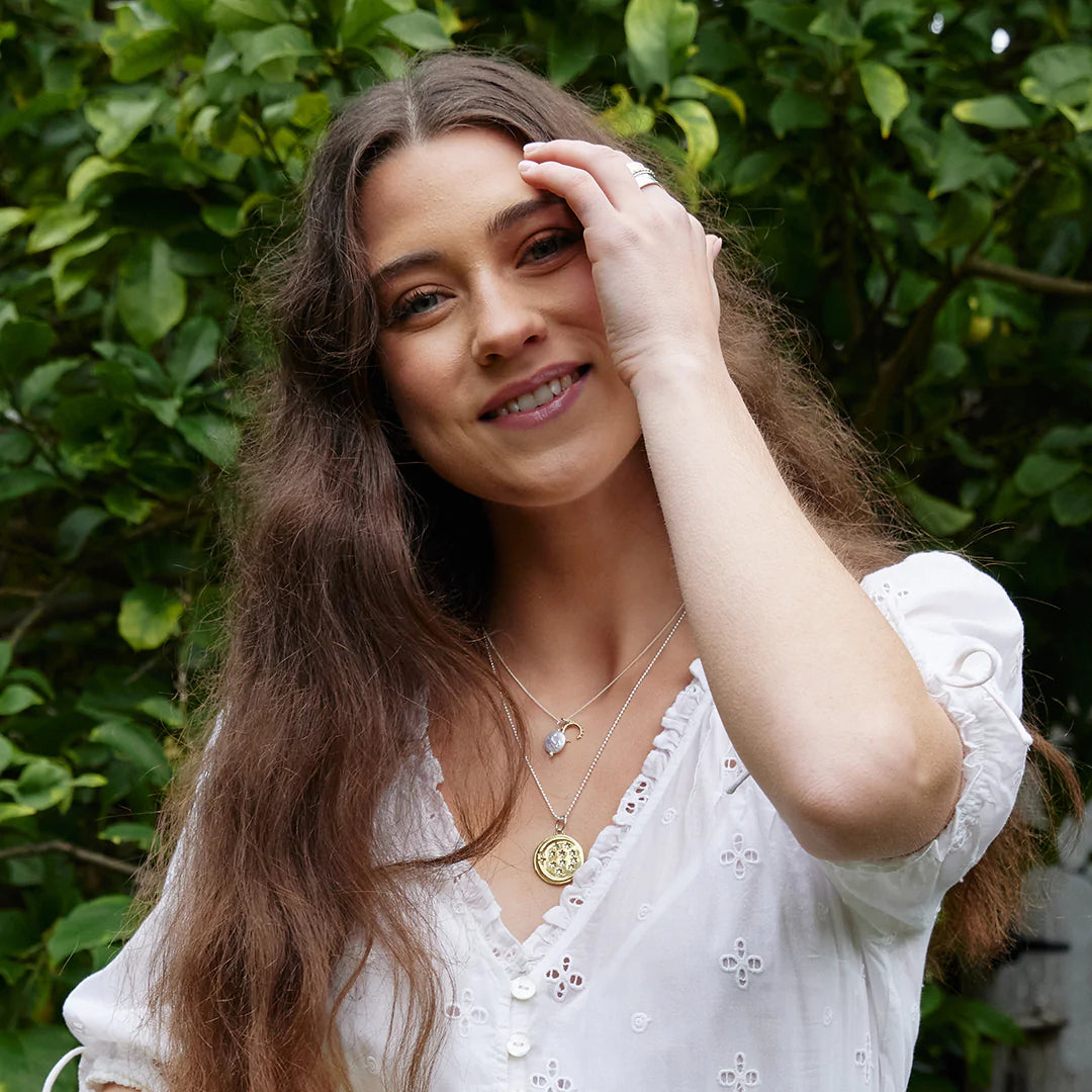 Glistening moon charm